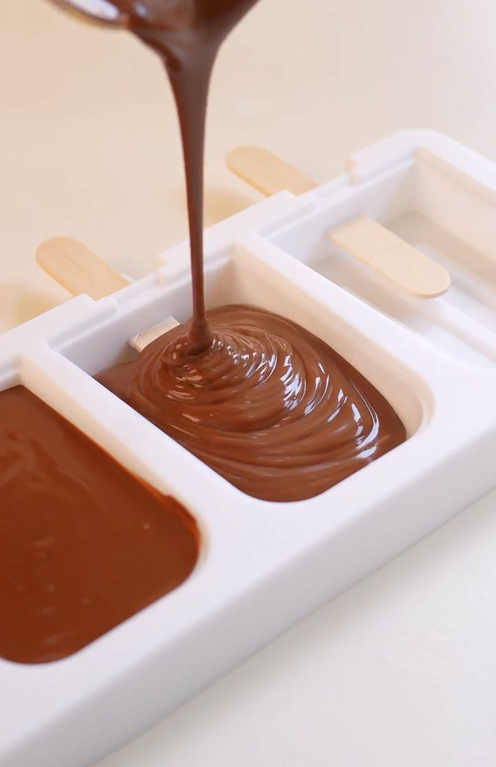 pour the chocolate mixture into your popsicle molds