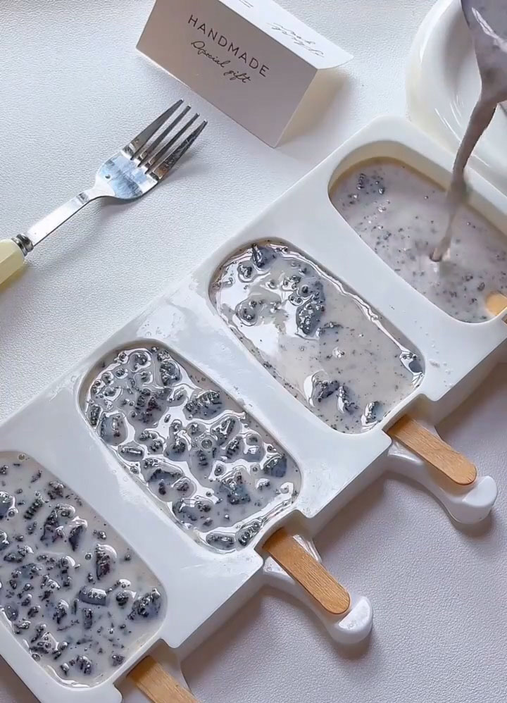 pour the mixture evenly into your popsicle molds