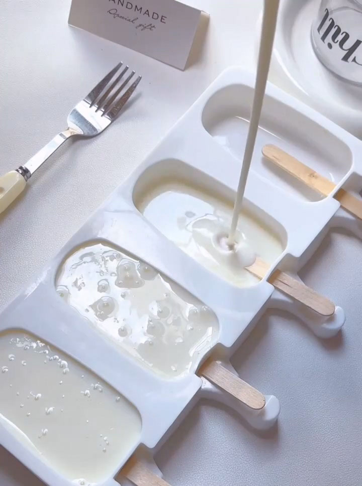 pour the mixture evenly into your popsicle molds