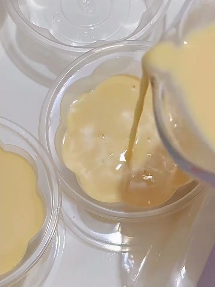 pour the strained pudding mixture into pudding cups