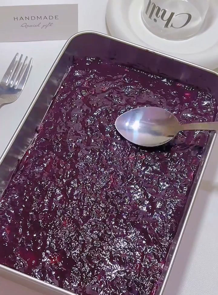 spread a thin layer of blueberry jam over the top surface