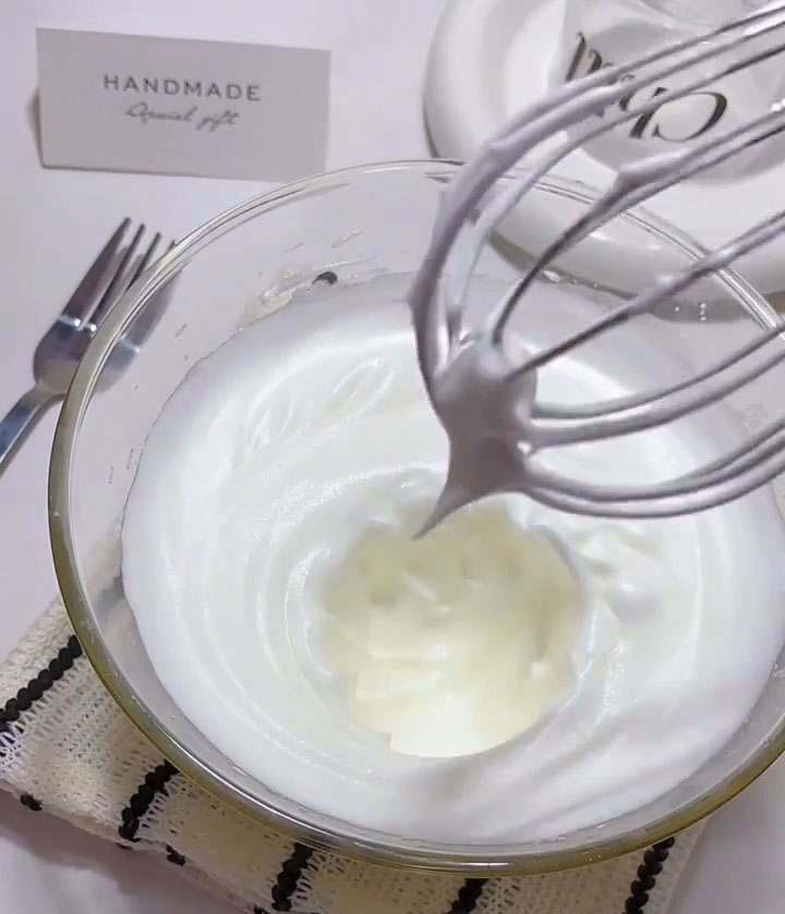 whip the egg whites until they reach stiff peaks