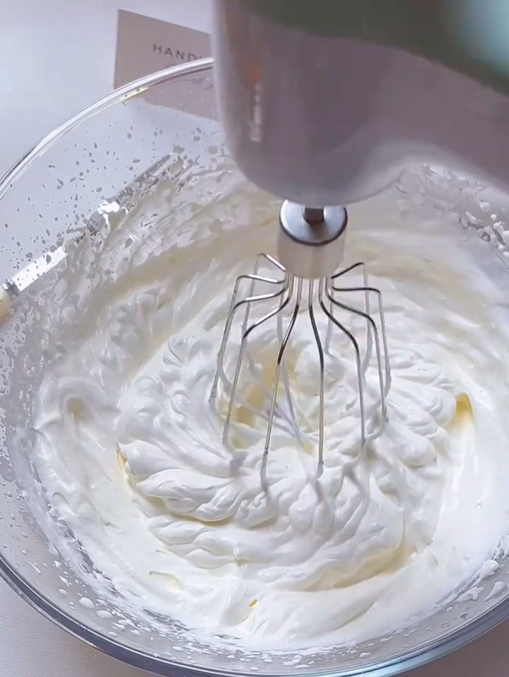 whip the mixture until it forms stiff peaks that hold their shape firmly